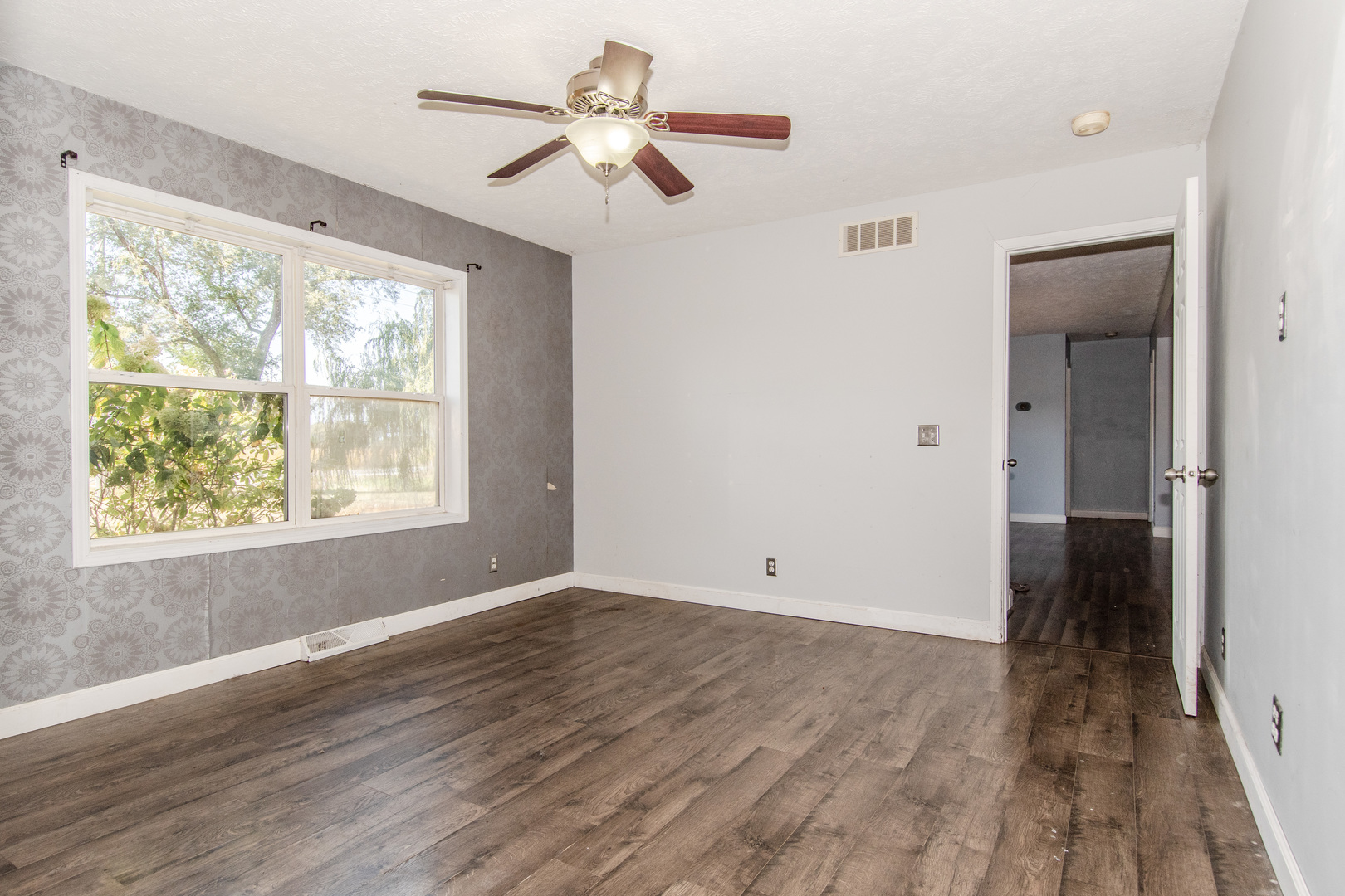 2970 North Dwight Road Morris, IL 60450 - Photo 33 of 43 a view of an empty room with wooden floor and a window