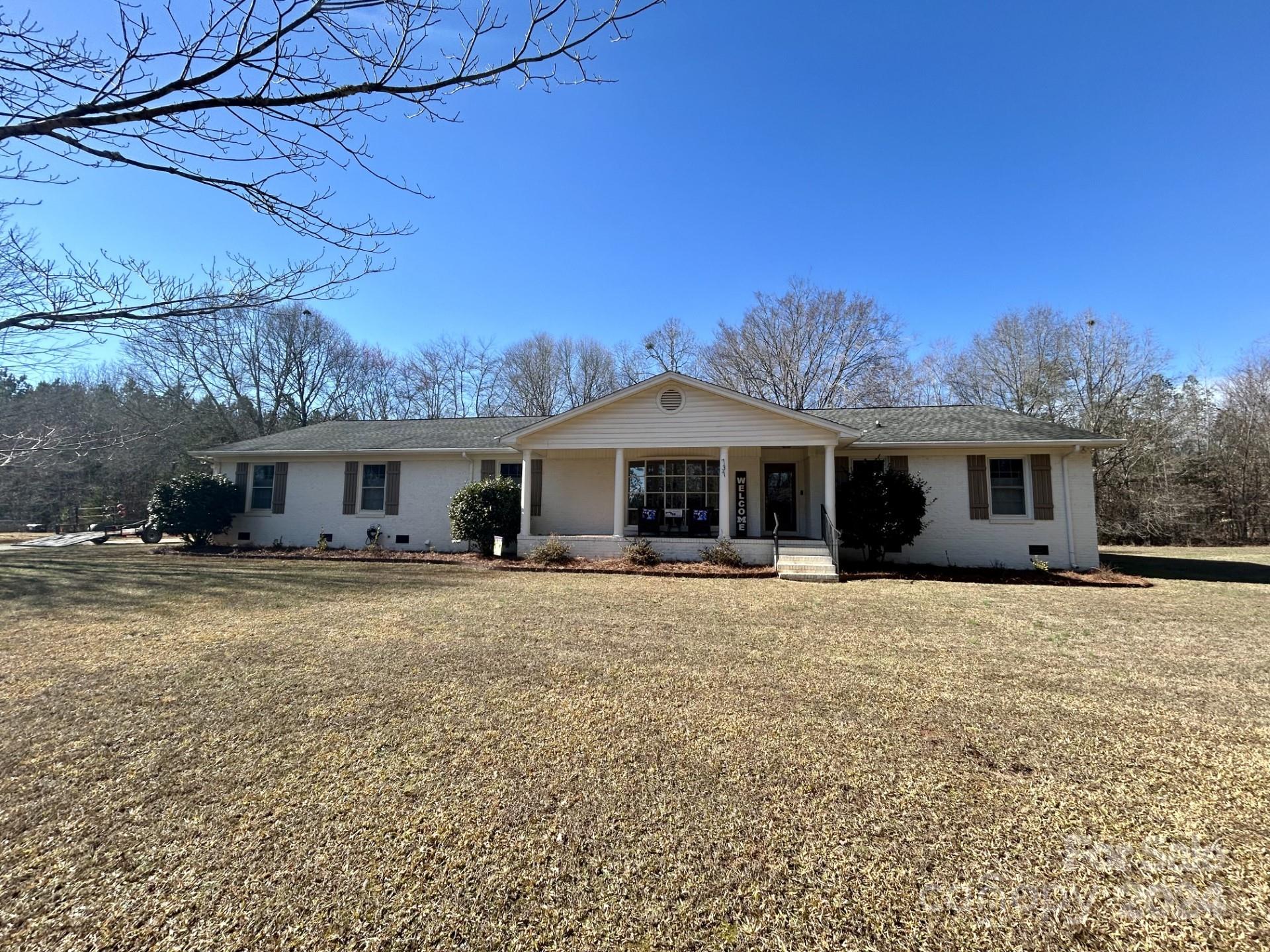 737 Miles Road Dallas, NC 28034 - Photo 1 of 47 a front view of a house with a garden