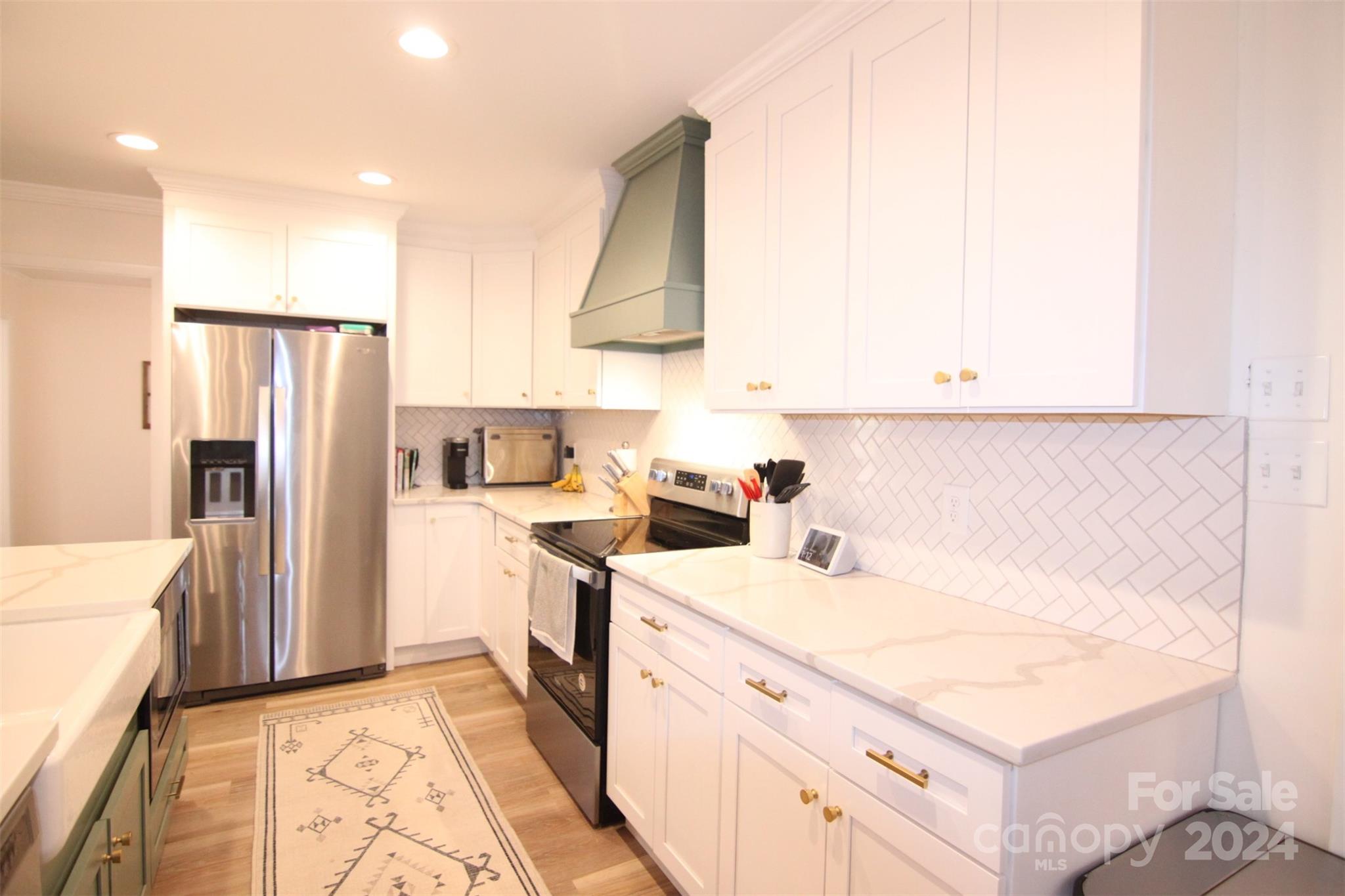 737 Miles Road Dallas, NC 28034 - Photo 15 of 47 a kitchen with a sink cabinets and stainless steel appliances