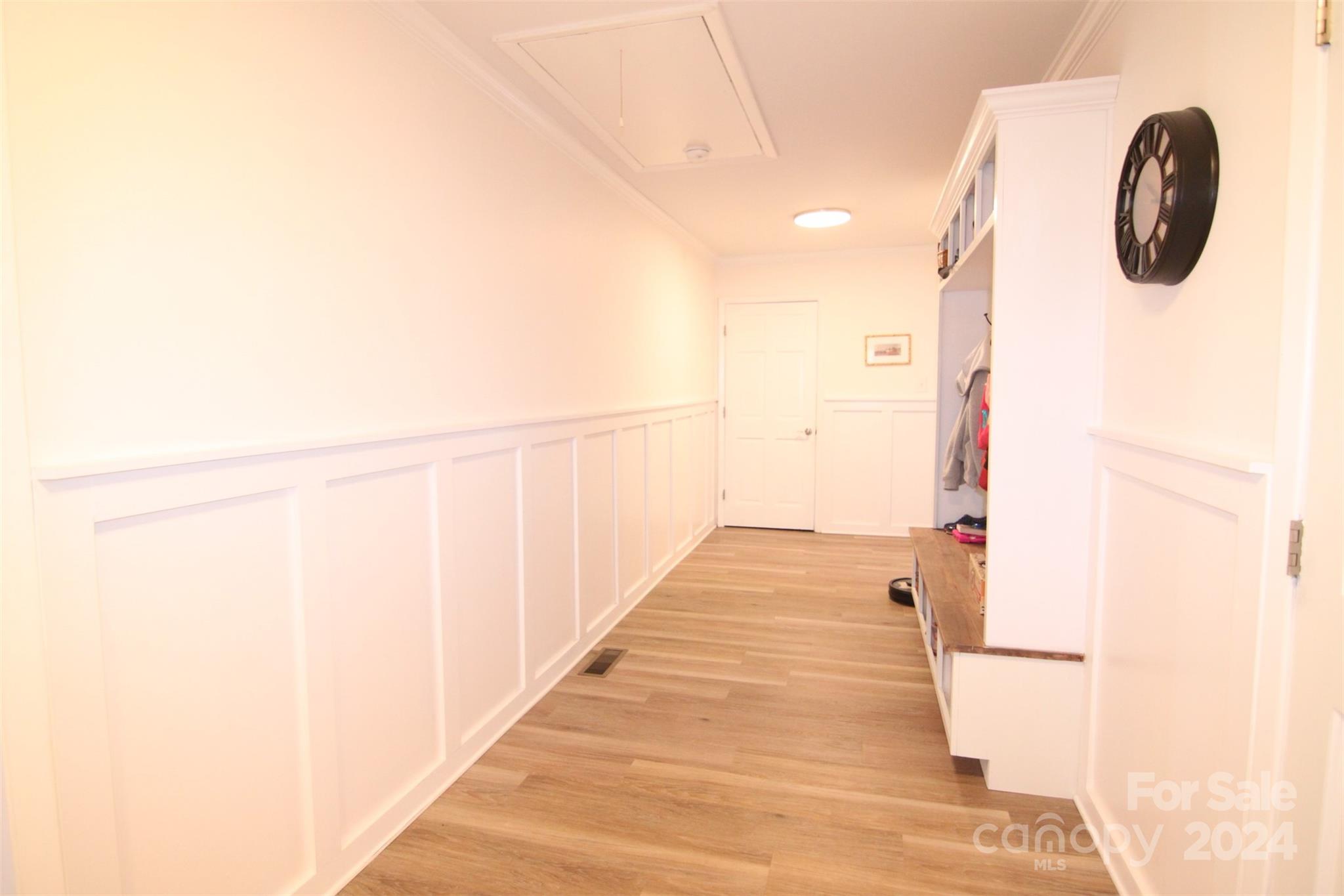 737 Miles Road Dallas, NC 28034 - Photo 17 of 47 a hallway with sliding door and wooden floor