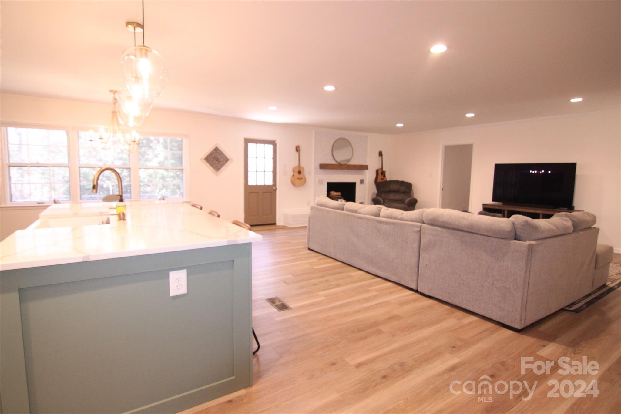 737 Miles Road Dallas, NC 28034 - Photo 24 of 47 a living room with furniture and a flat screen tv