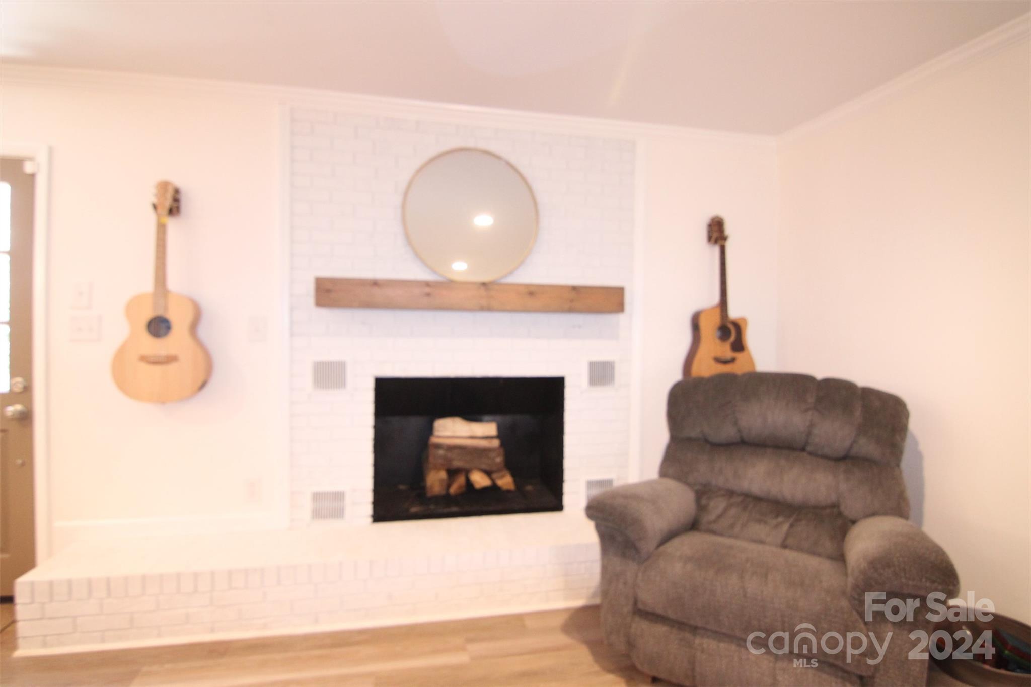 737 Miles Road Dallas, NC 28034 - Photo 27 of 47 a living room with furniture and a fireplace