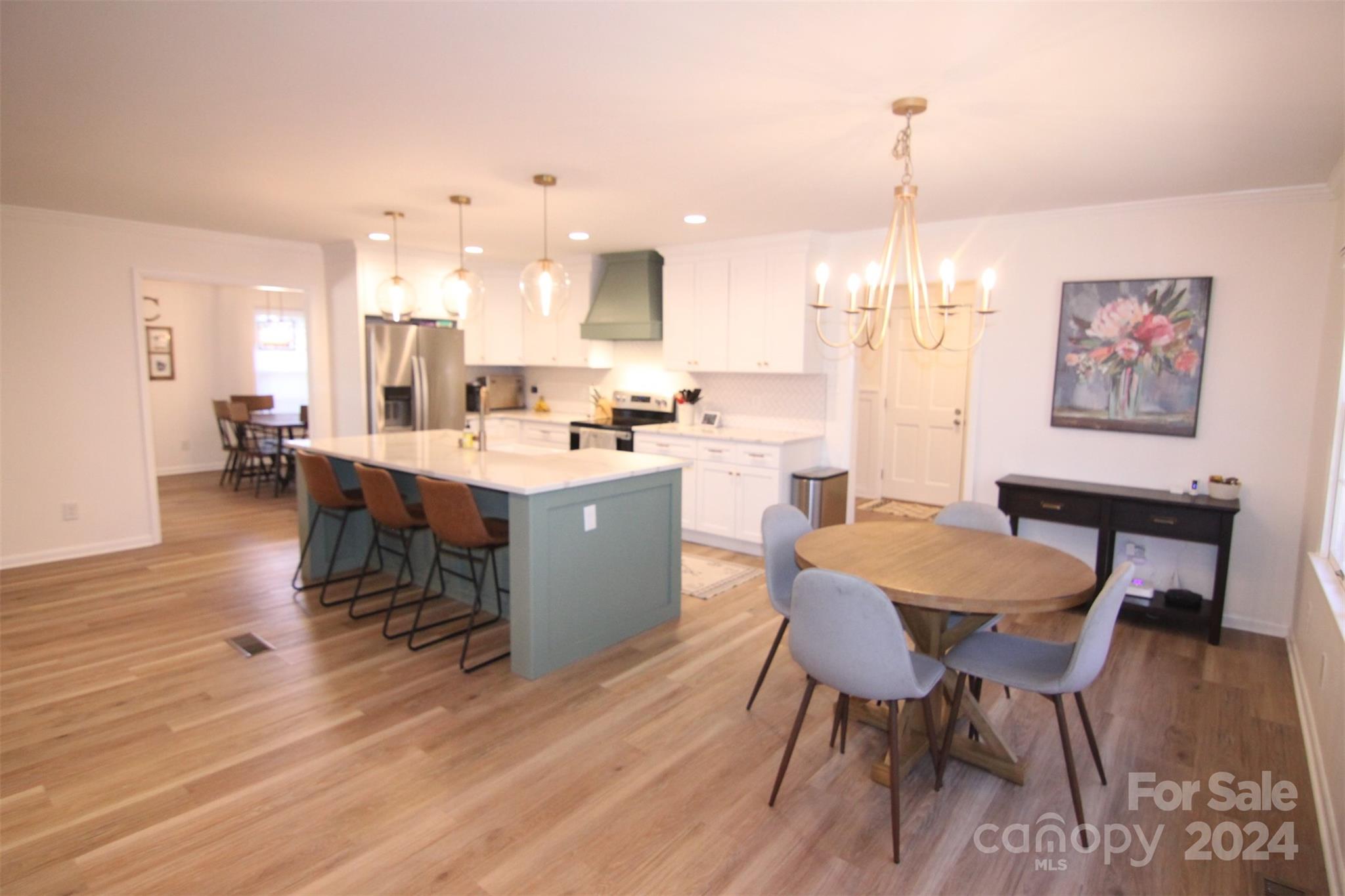 737 Miles Road Dallas, NC 28034 - Photo 29 of 47 a large kitchen with a table and chairs