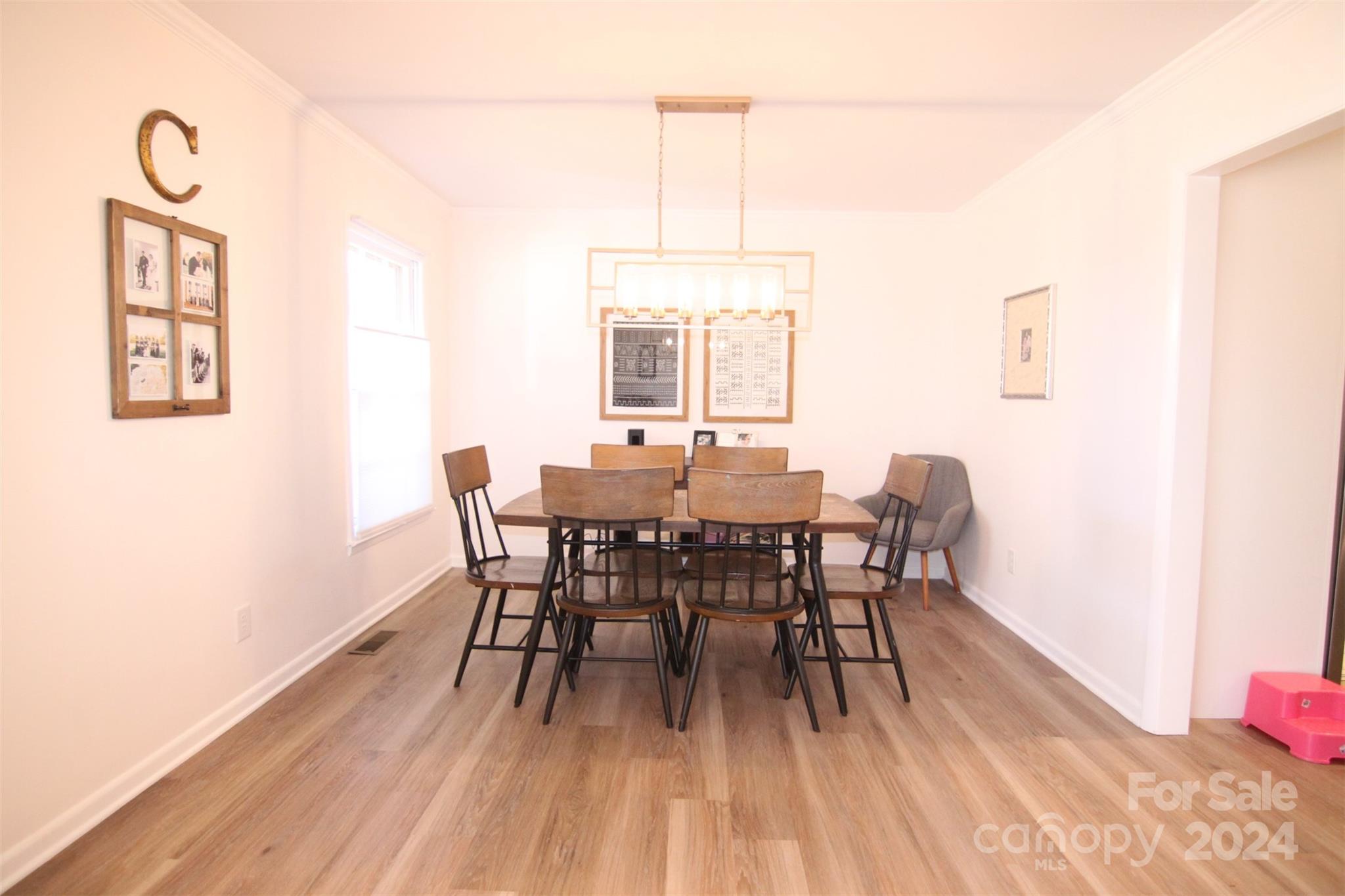 737 Miles Road Dallas, NC 28034 - Photo 7 of 47 a view of a dining room with furniture window and wooden floor
