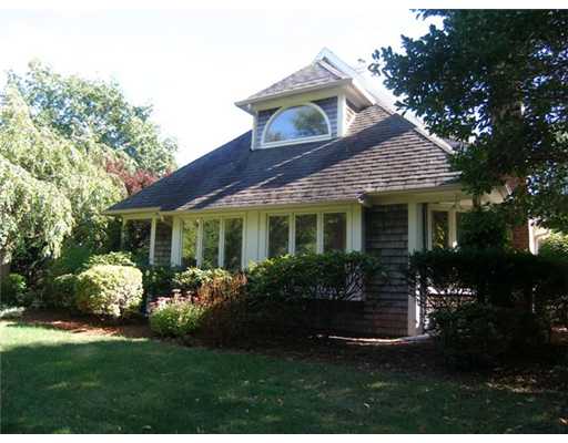 Exterior Front. MATURE PLANTINGS PROVIDE PRIVACY