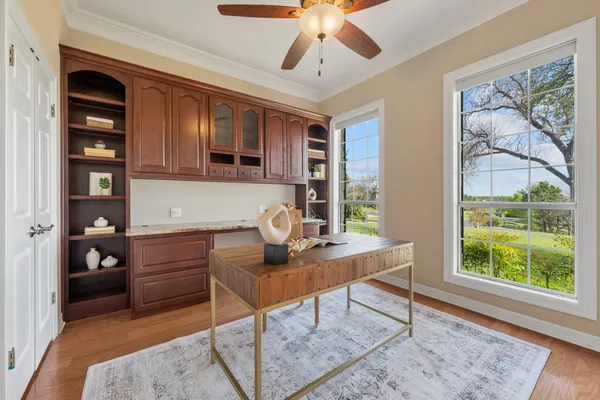 a workspace with furniture and window