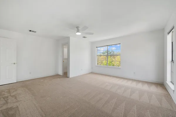 a view of an empty room with a window