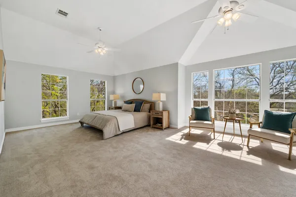 a bed room with a bed and a couch