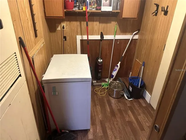 a view of washer and dryer with wooden floor