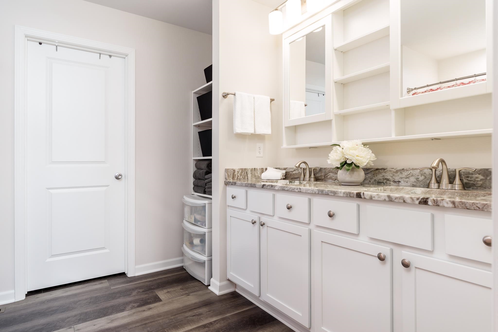 779 Boz Way Belvidere, IL 61008 - Photo 18 of 39 a kitchen with granite countertop white cabinets and white appliances