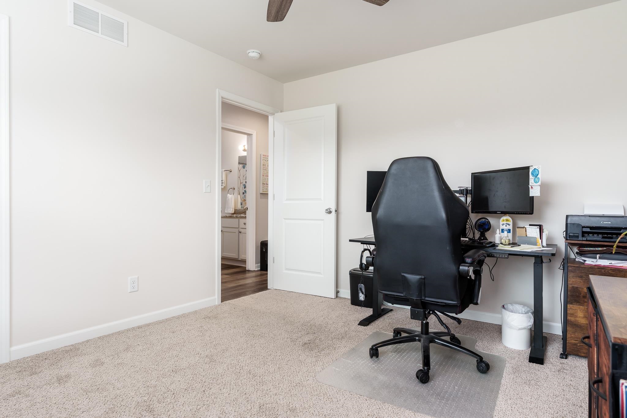 779 Boz Way Belvidere, IL 61008 - Photo 19 of 39 a view of a workspace with furniture and a window