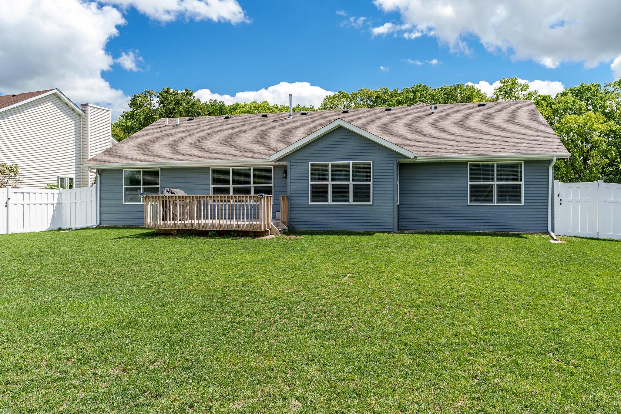 779 Boz Way Belvidere, IL 61008 - Photo 20 of 39 a front view of a house with a garden