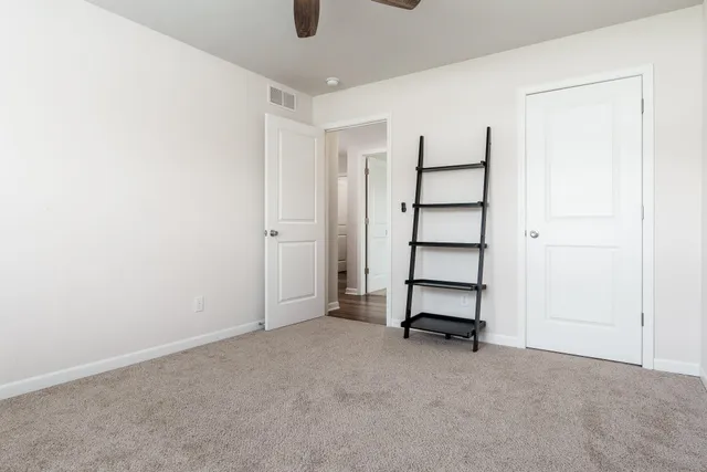 a view of an empty room with a bathroom