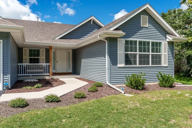 a front view of a house with garden
