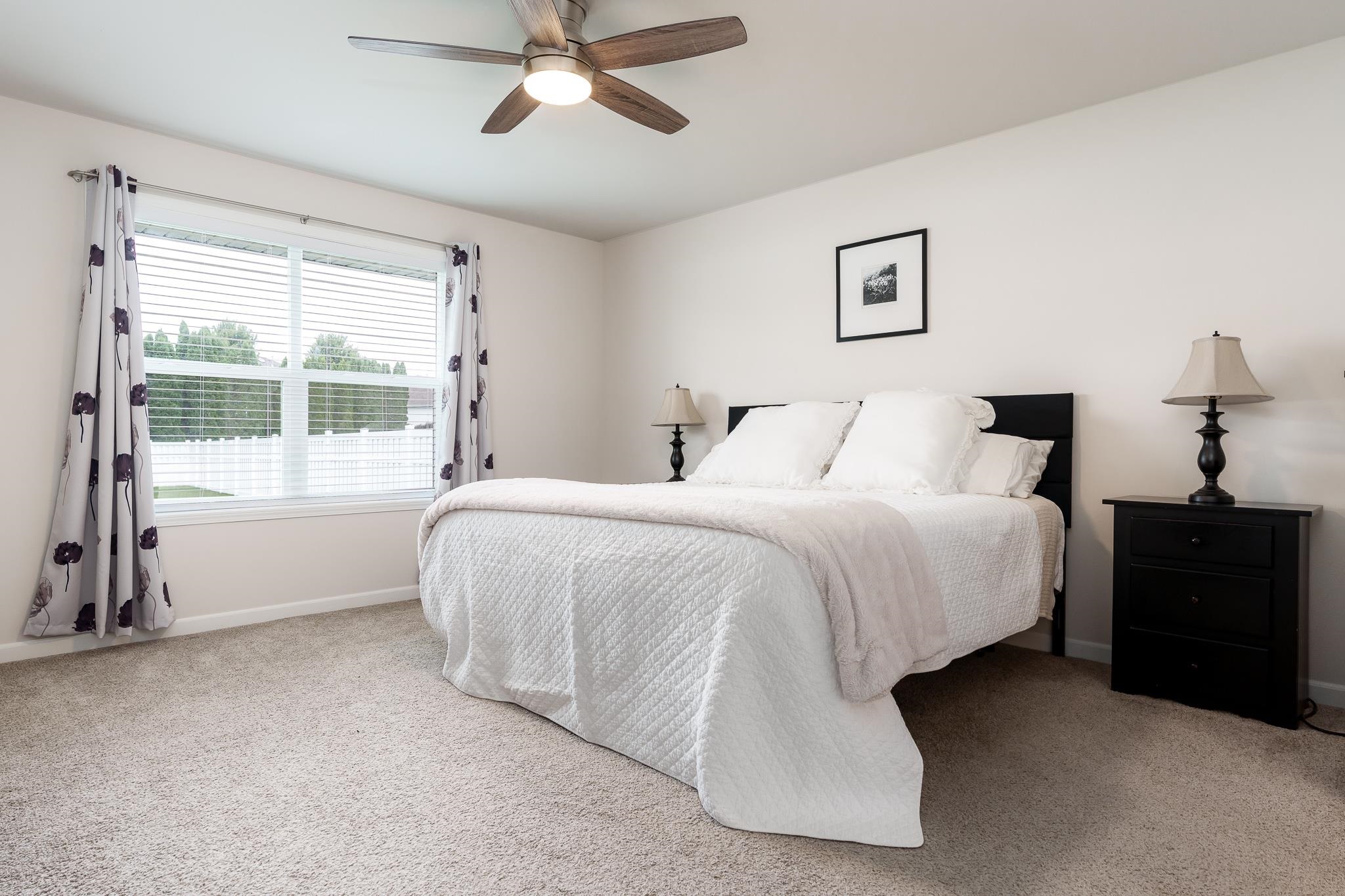 779 Boz Way Belvidere, IL 61008 - Photo 32 of 39 a spacious bedroom with a bed and a window