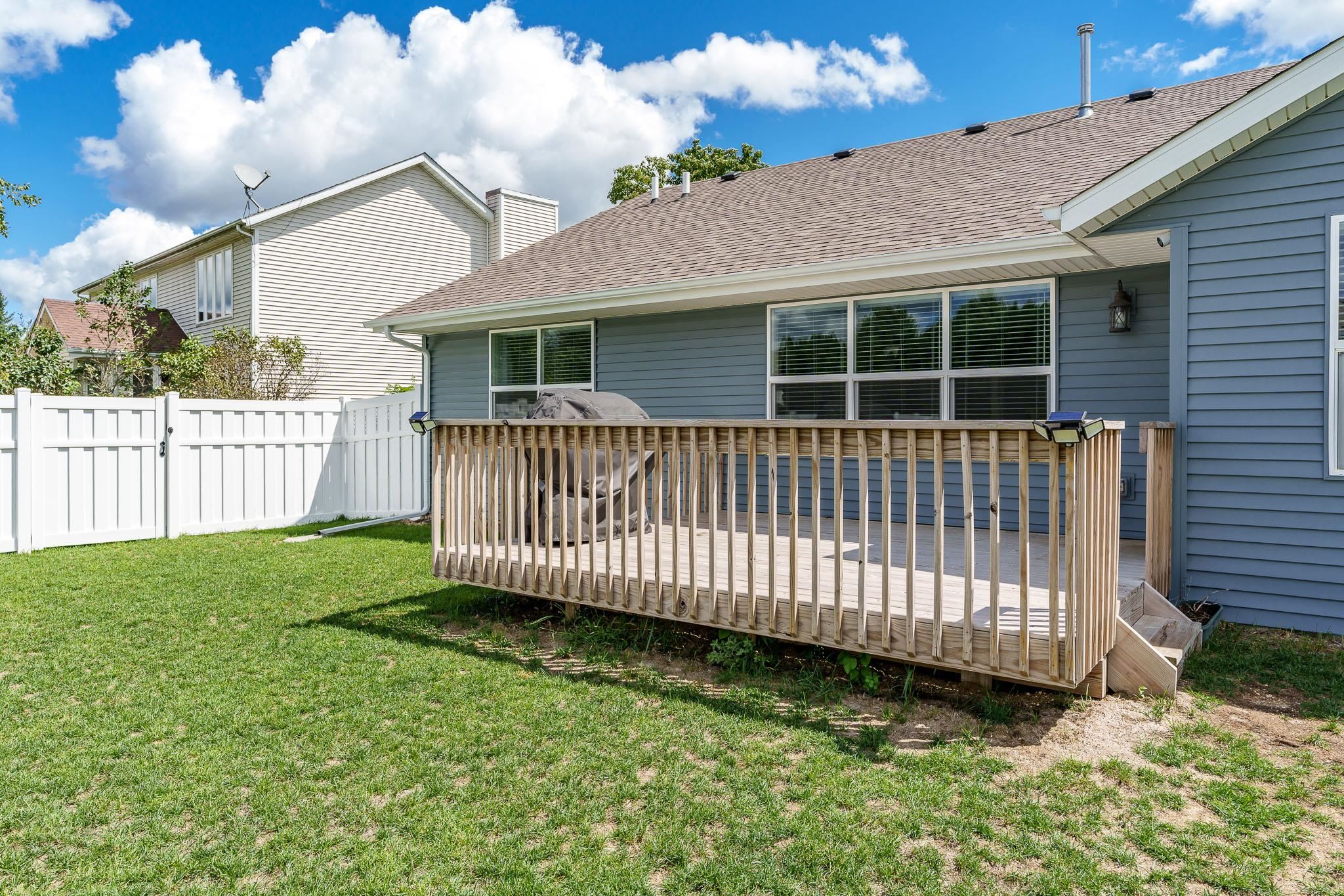 779 Boz Way Belvidere, IL 61008 - Photo 9 of 39 a view of a house with a yard and deck