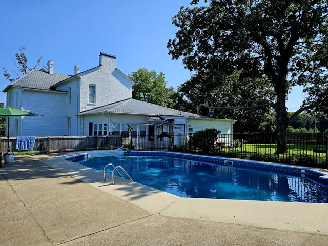 a view of a house with swimming pool