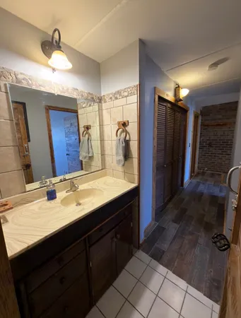 a bathroom with a sink double vanity and a mirror