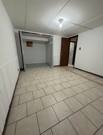 a view of a refrigerator and window in a room