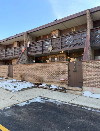 a front view of a building with garage