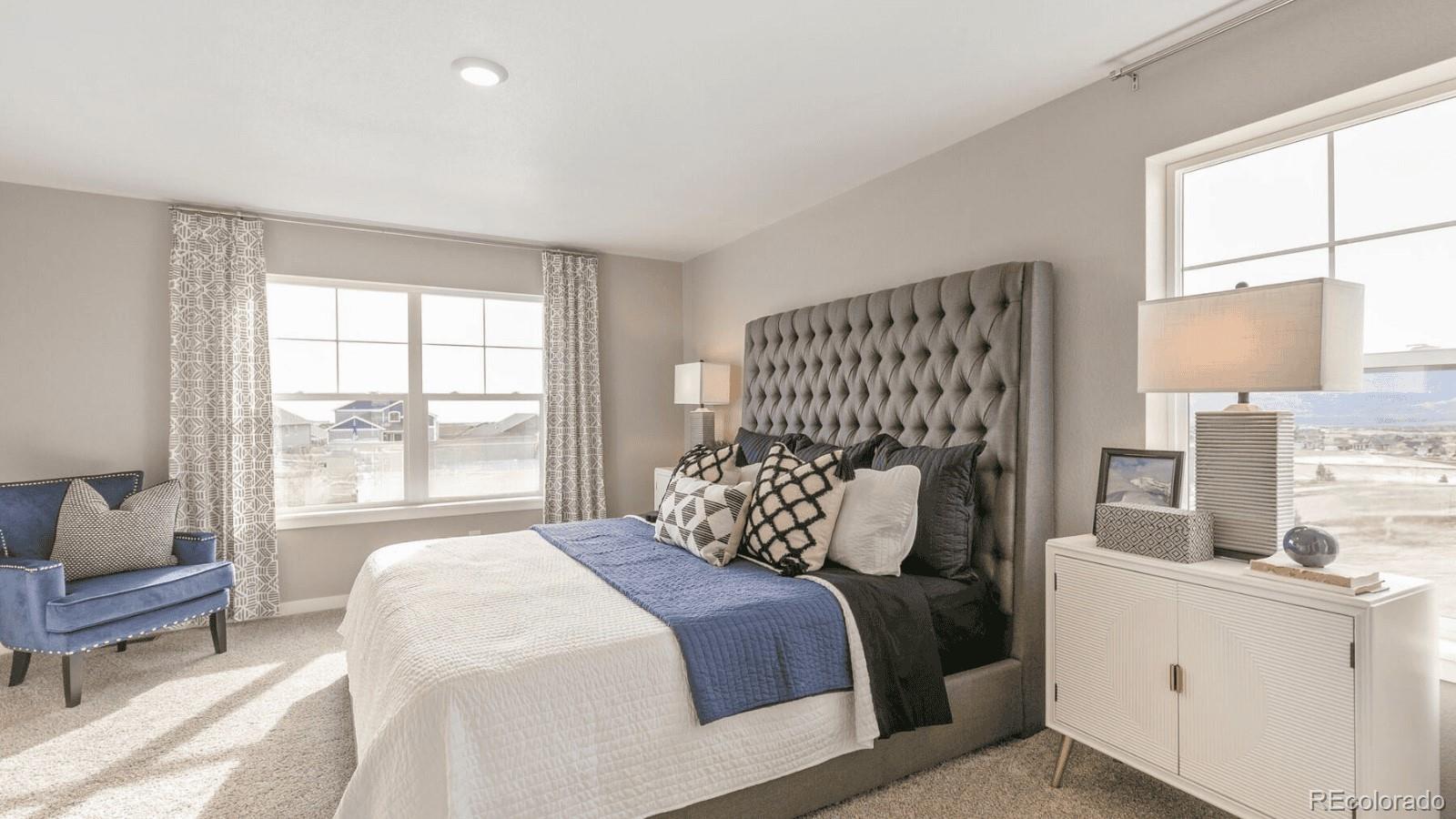 810 North Clubview Street Watkins, CO 80137 - Photo 11 of 21 a bedroom with a large bed and a window