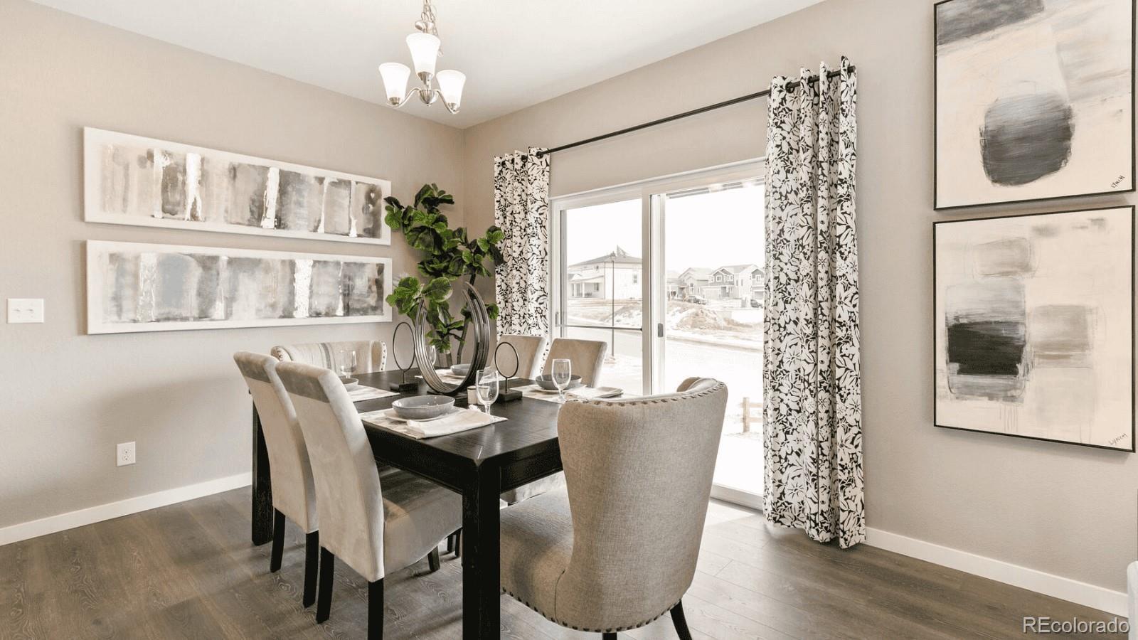 810 North Clubview Street Watkins, CO 80137 - Photo 7 of 21 a dining room with furniture window and wooden floor