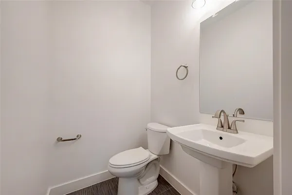 an empty room with a ceiling fan and windows