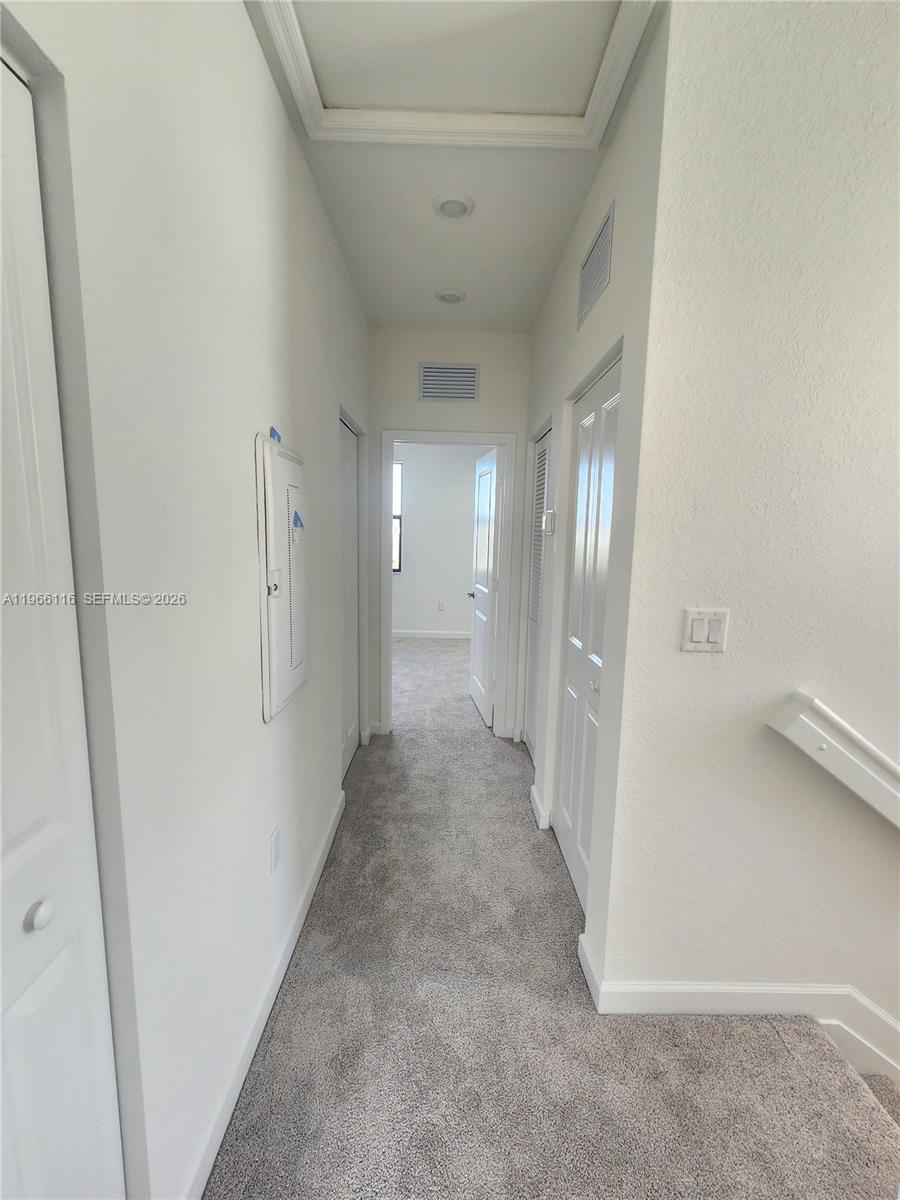 23331 Southwest 128th Avenue, Unit 23331 Homestead, FL 33032 - Photo 13 of 16 a view of a hallway