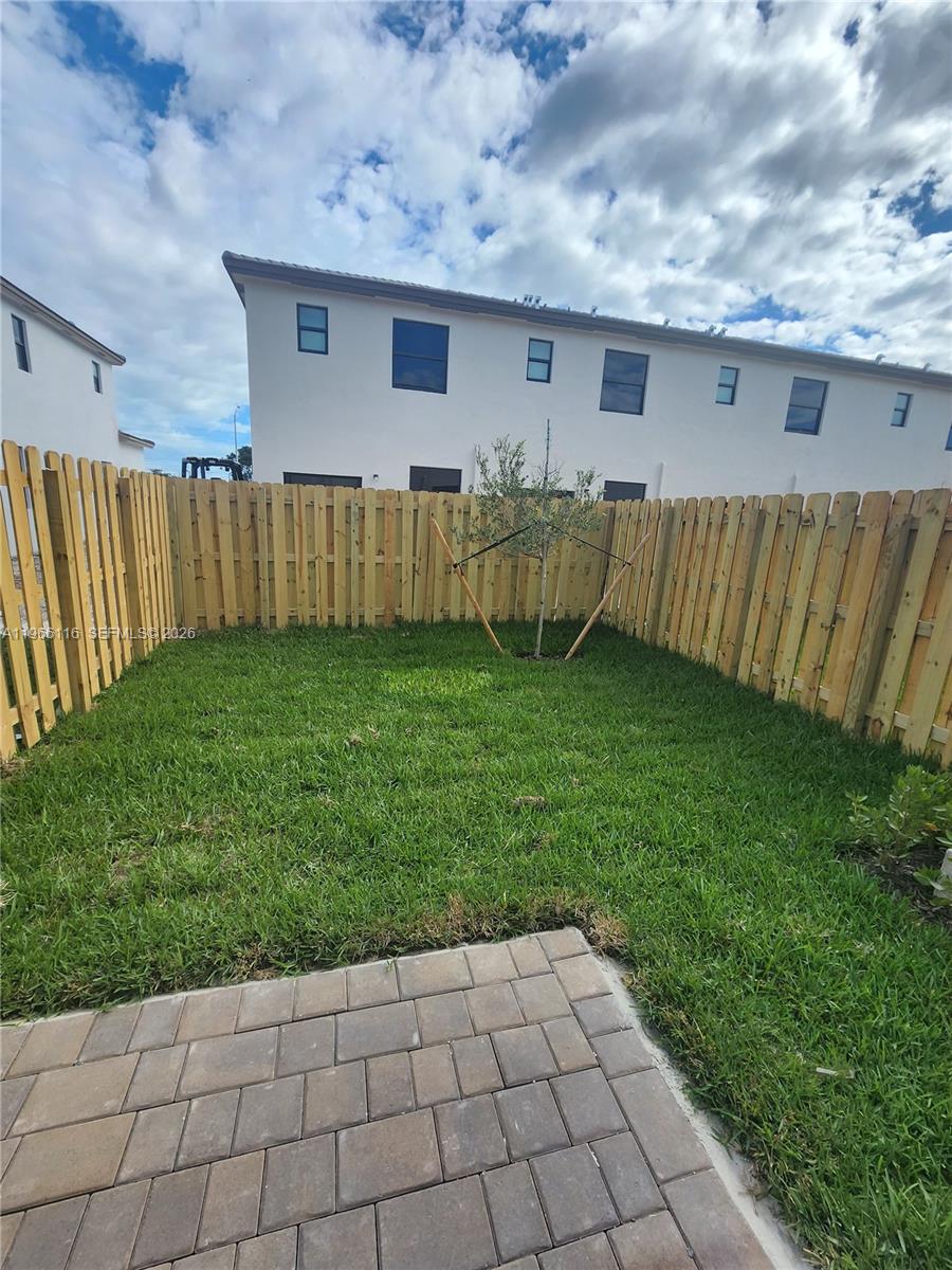 23331 Southwest 128th Avenue, Unit 23331 Homestead, FL 33032 - Photo 16 of 16 a backyard of a house with lots of green space