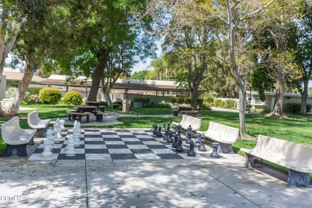 a view of backyard with seating area and green space