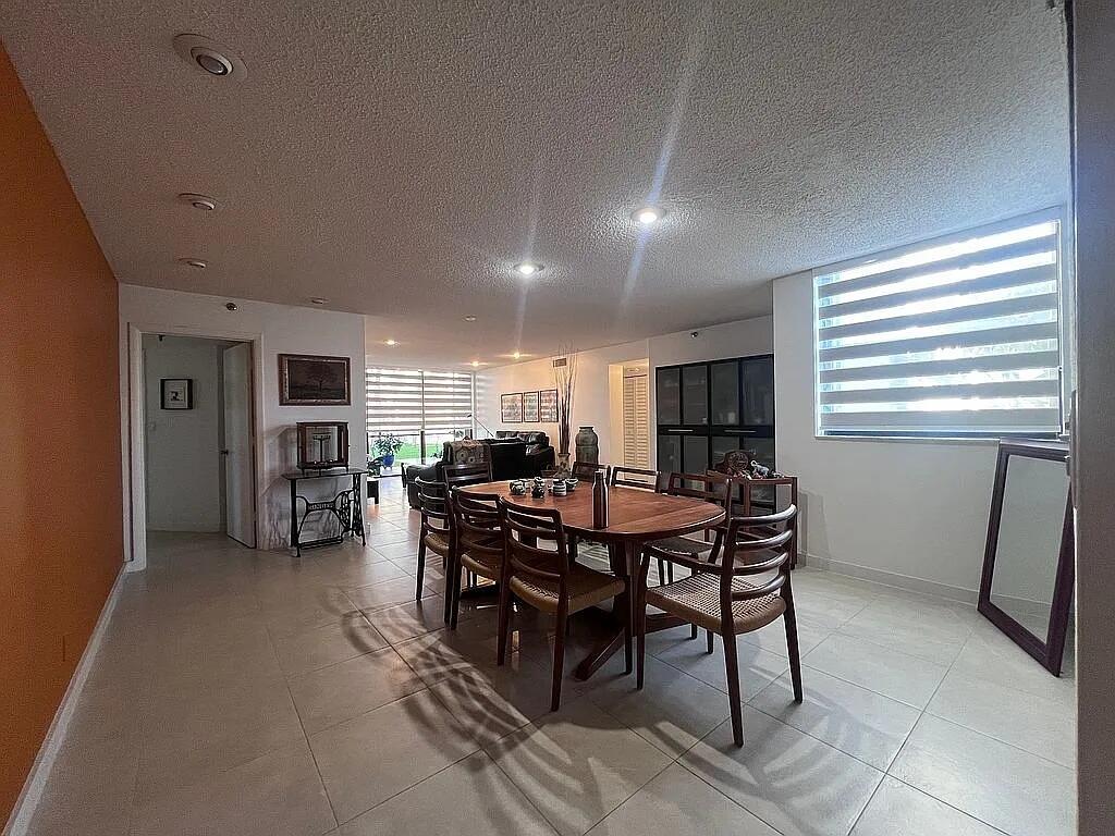 6463 La Costa Drive, Unit 105 Boca Raton, FL 33433 - Photo 8 of 40 a view of a dining room with furniture