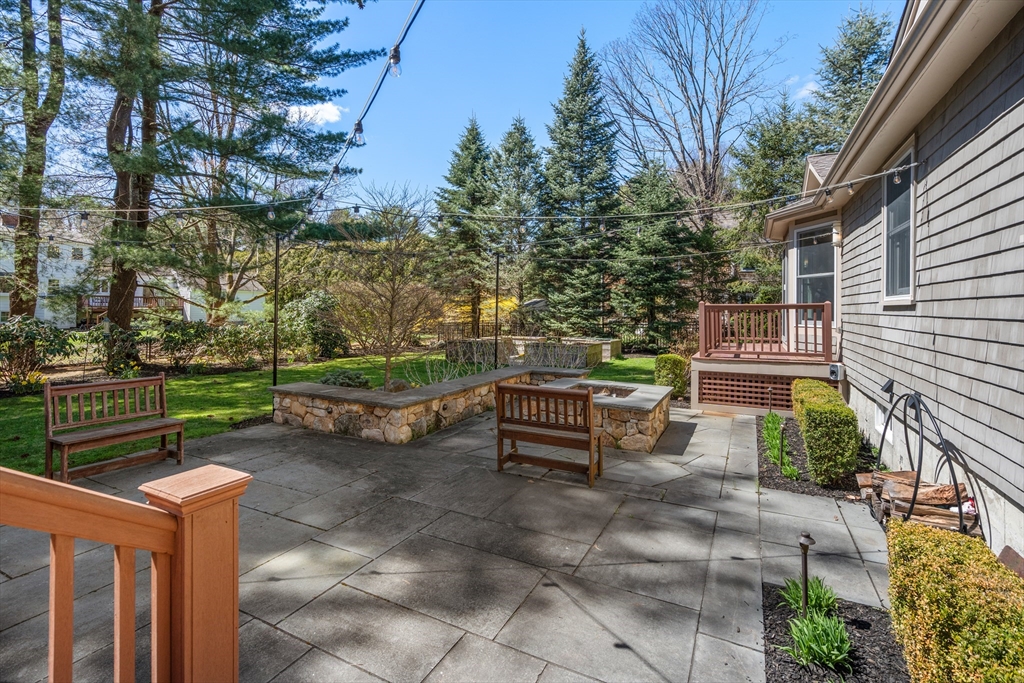 22 Crestview Road Belmont, MA 02478 - Photo 29 of 36 a view of a bench in a backyard