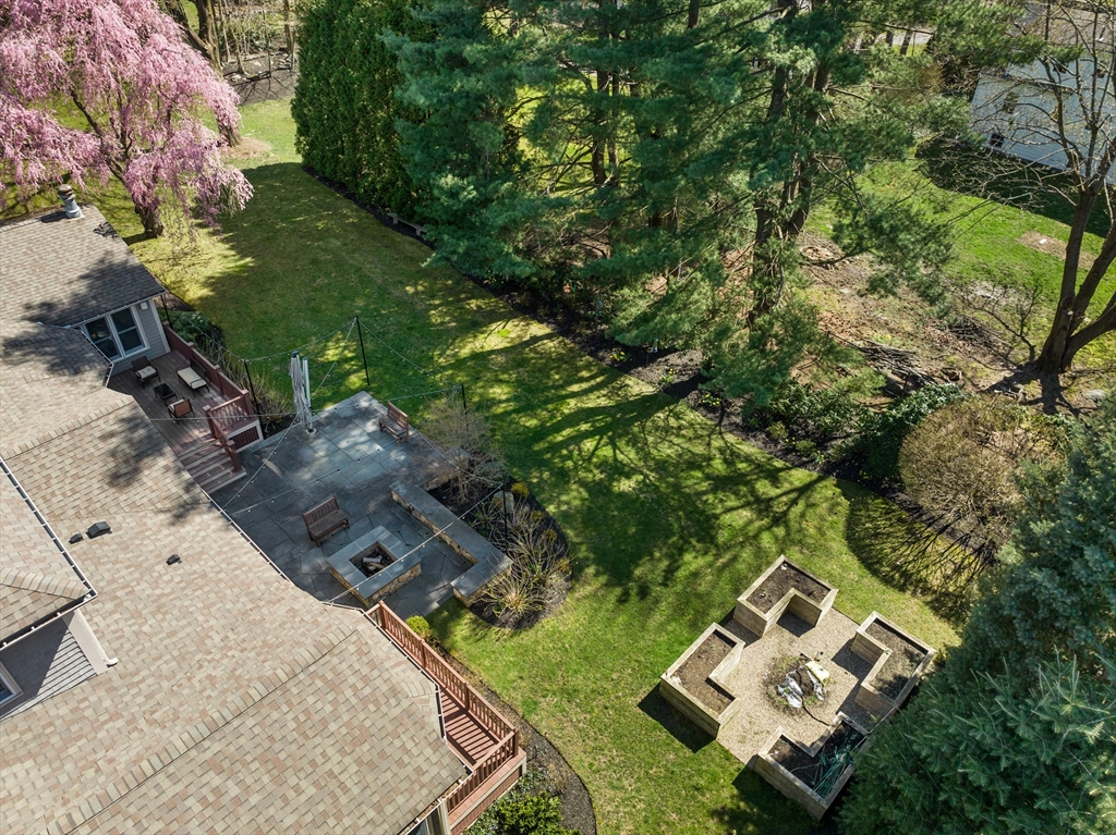 22 Crestview Road Belmont, MA 02478 - Photo 32 of 36 an aerial view of a house with a yard