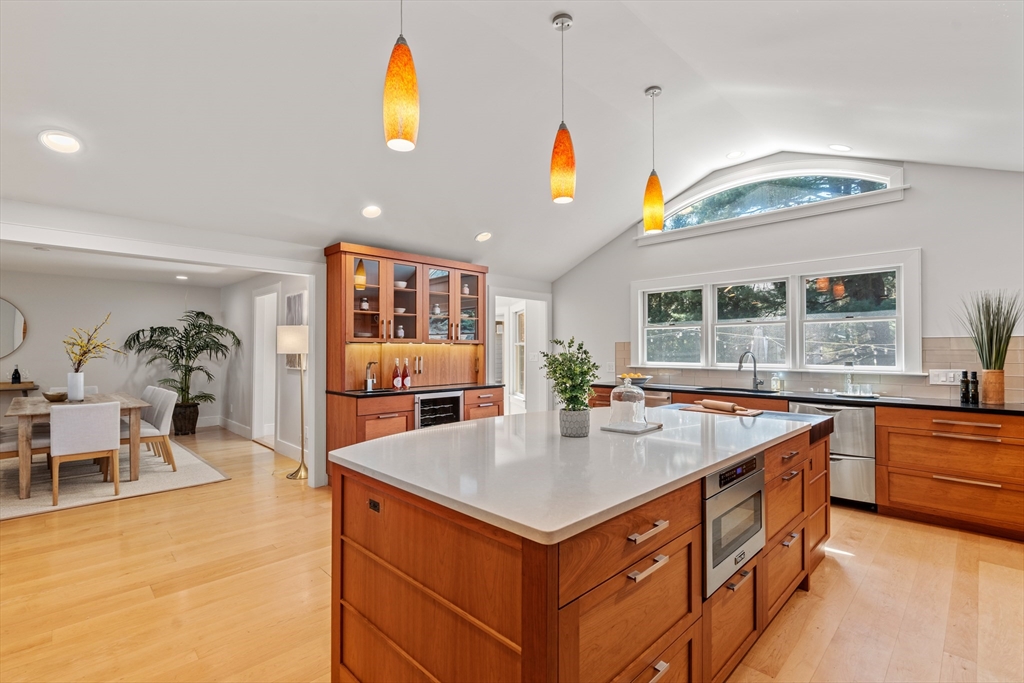 22 Crestview Road Belmont, MA 02478 - Photo 8 of 36 a kitchen with stainless steel appliances granite countertop a sink and a large window