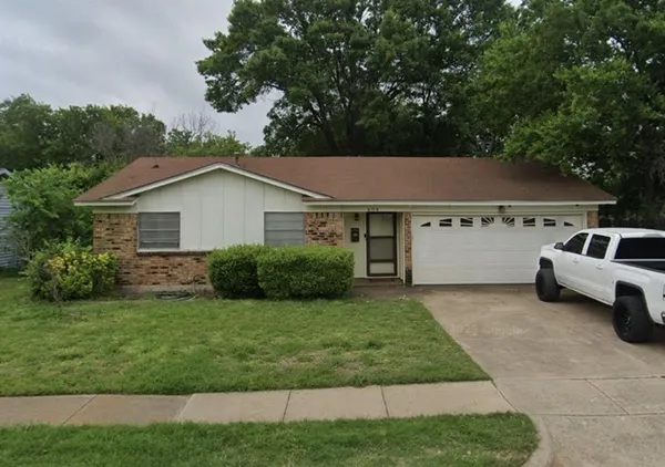 a house view with a garden space