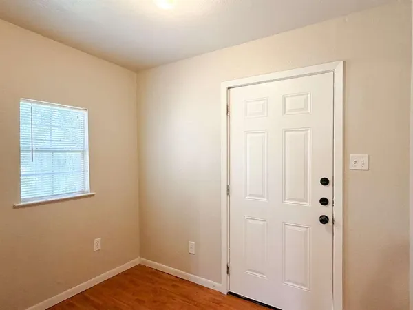 an empty room with closet area