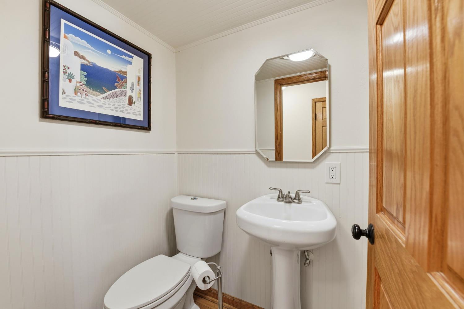 7201 Happy Valley Road Somerset, CA 95684 - Photo 23 of 75 Right off the living room and just down the hallway is a half bathroom for guests to enjoy.