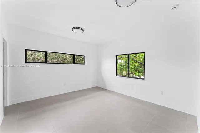 an empty room with windows