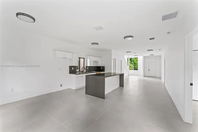 a view of a kitchen with a sink
