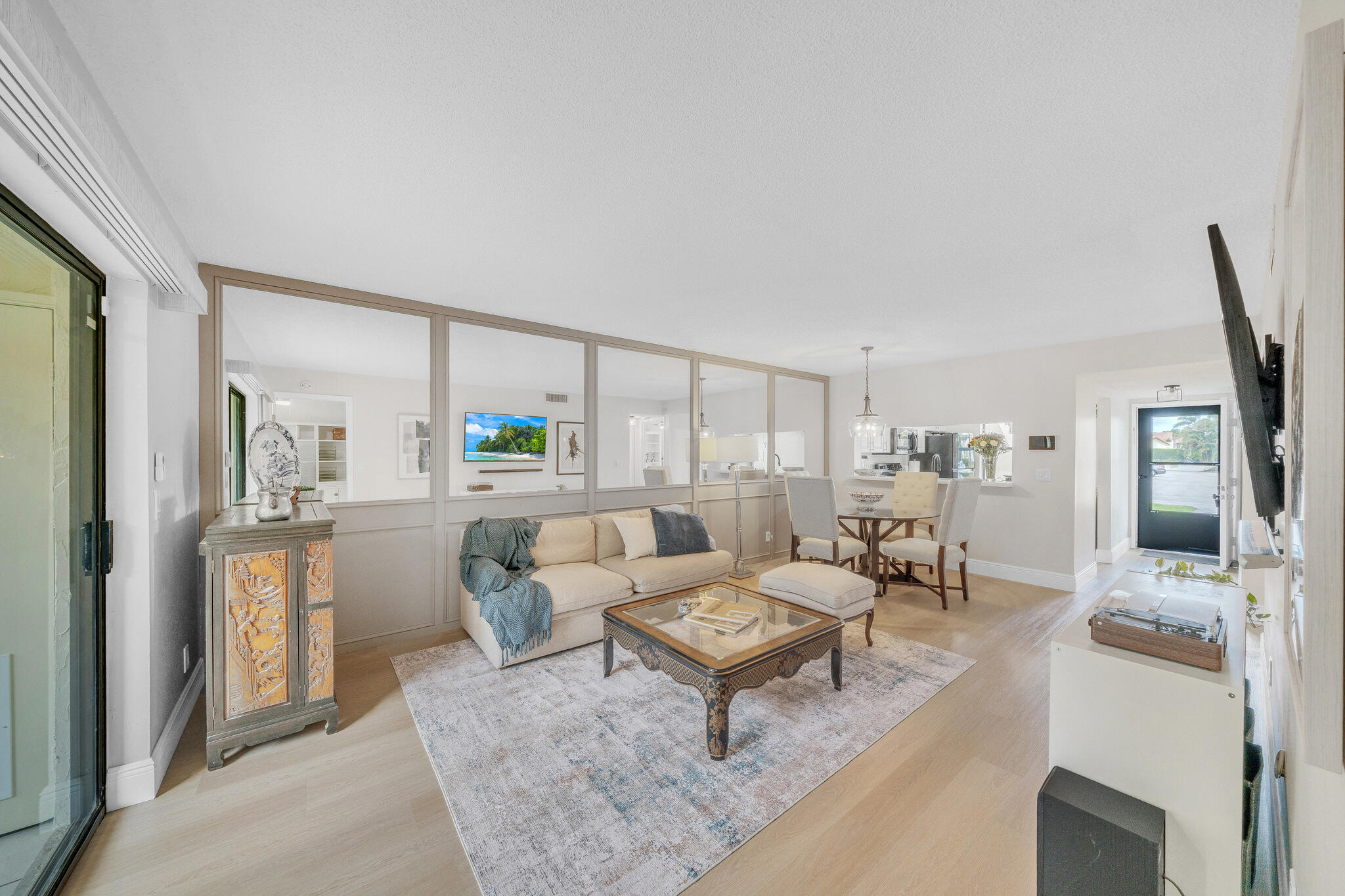 22136 Palms Way, Unit 103 Boca Raton, FL 33433 - Photo 27 of 42 a living room with furniture and a wooden floor
