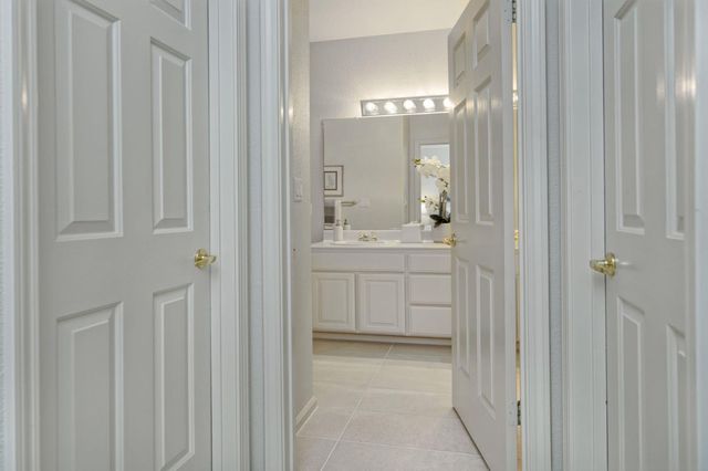 a bathroom with a sink a light fixture and a mirror