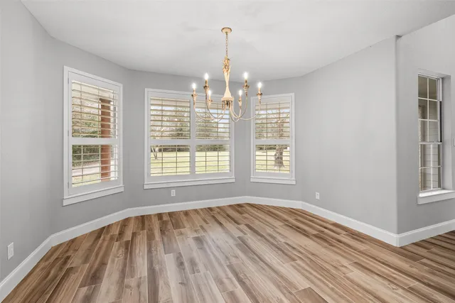 a kitchen with a stove and a refrigerator