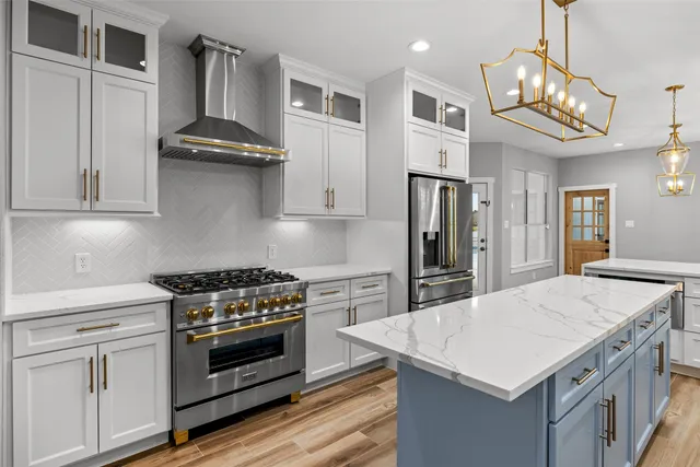 a kitchen with stainless steel appliances granite countertop wooden cabinets stove and sink
