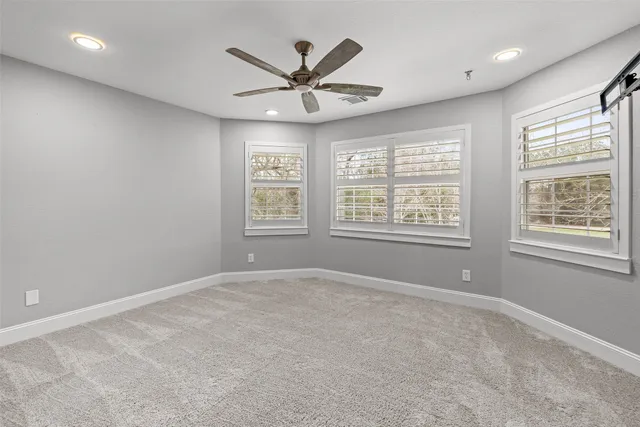 a balcony with wooden floor and fence