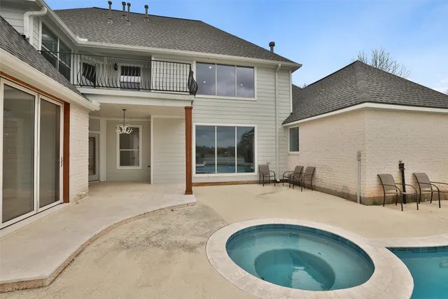 a view of a swimming pool with a yard