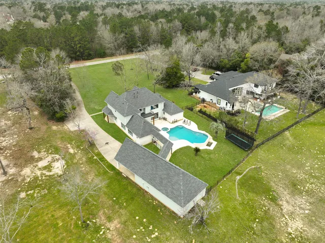 a aerial view of a house with a lake view