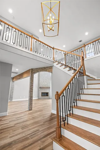 a view of entryway with wooden floor and windows