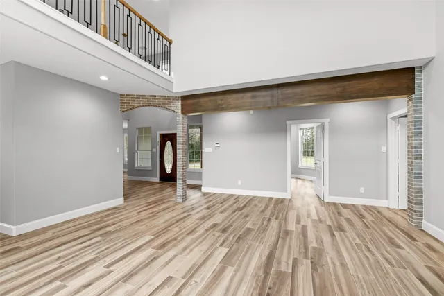 a kitchen with kitchen island a sink appliances and cabinets