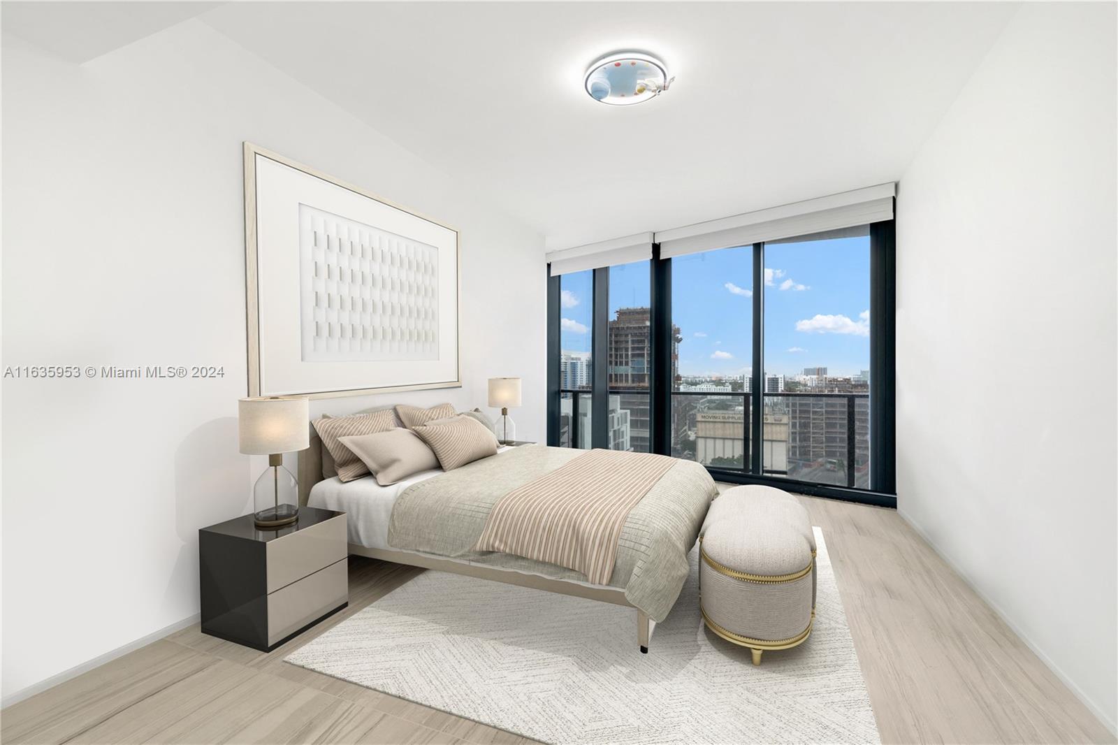 1000 Biscayne Boulevard, Unit 1202 Miami, FL 33132 - Photo 15 of 23 a living room with furniture and a large window