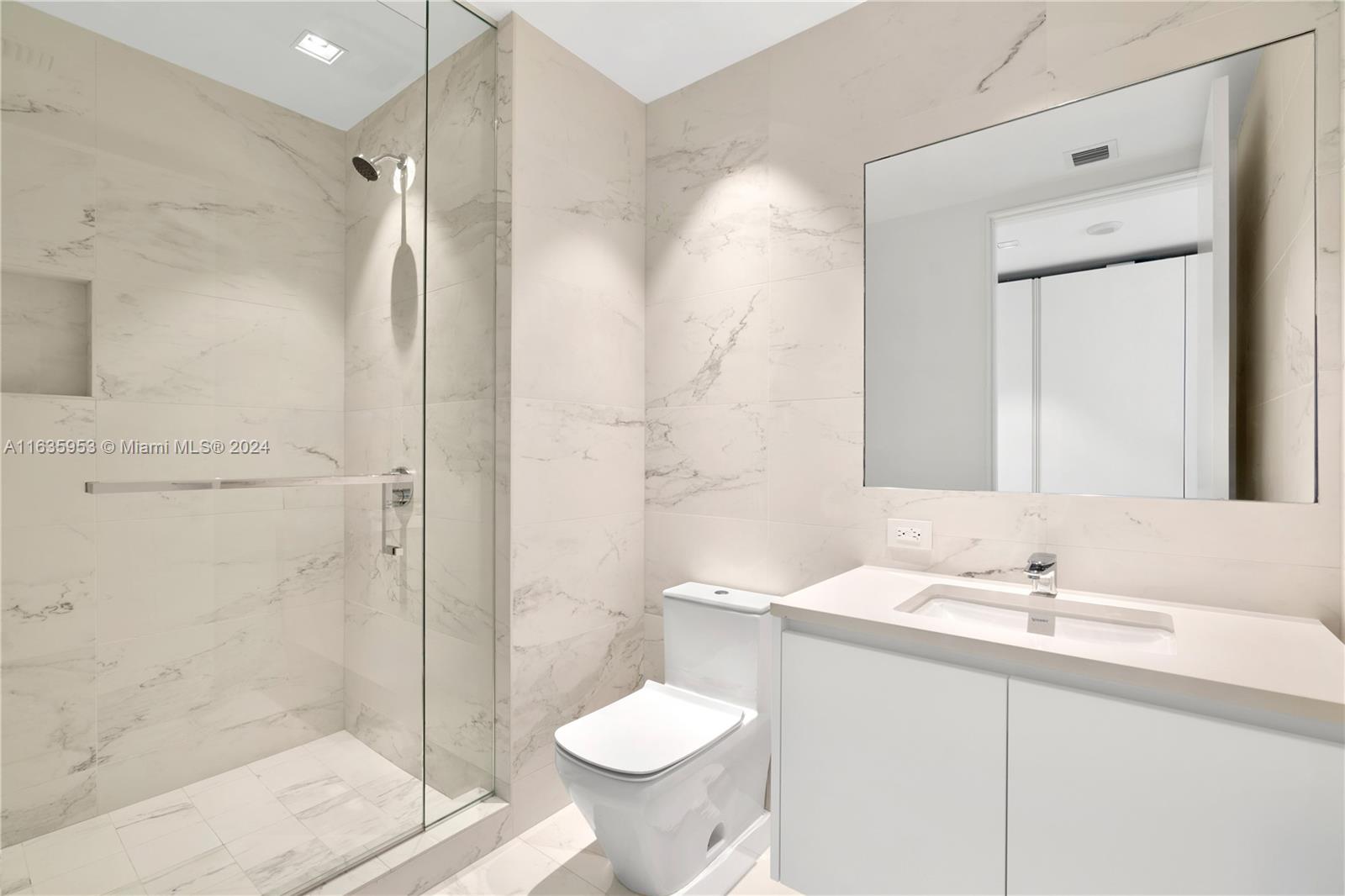 1000 Biscayne Boulevard, Unit 1202 Miami, FL 33132 - Photo 16 of 23 a bathroom with a sink toilet and shower